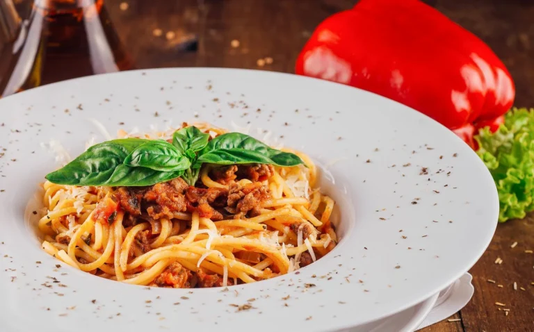 Spaghetti Bolognese with tomato meat sauce and fresh basil